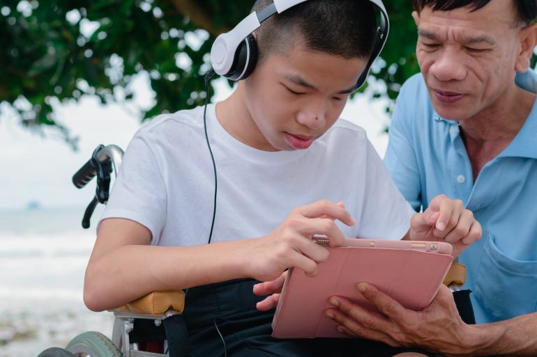 A student uses a tablet for learning